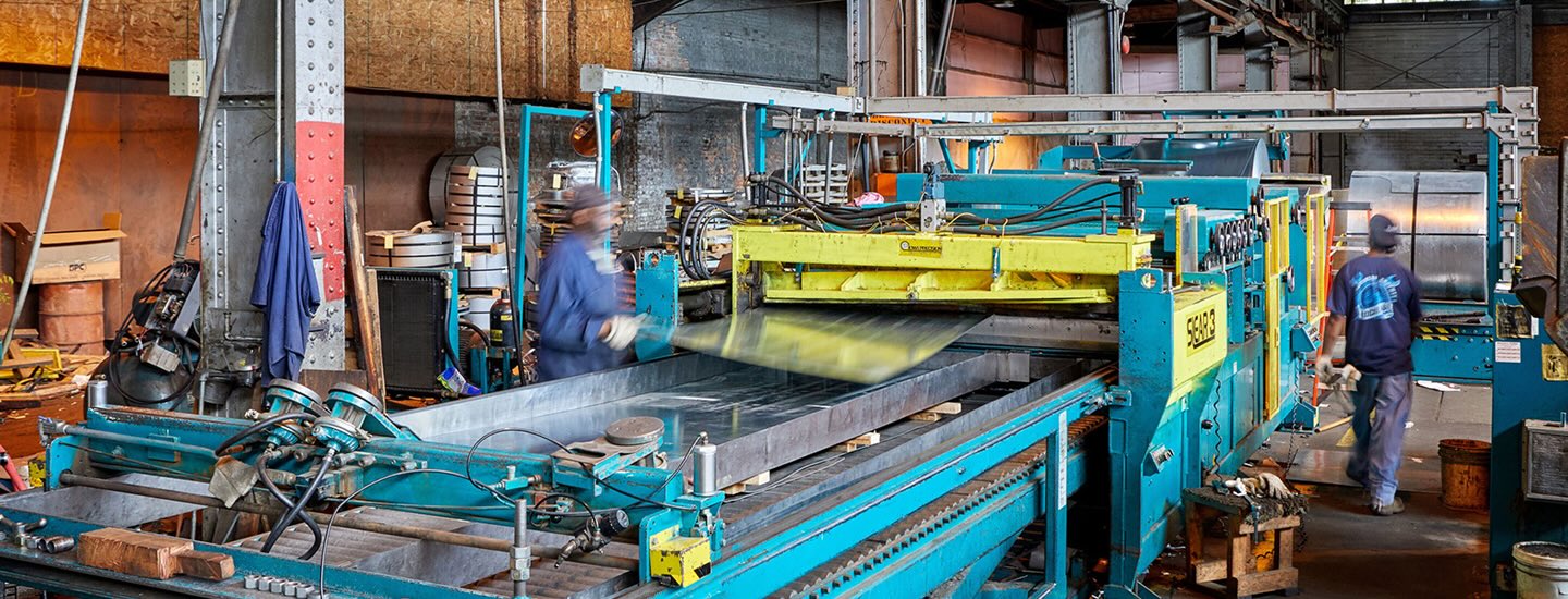 Flat rolled steel coils in a steel processing facility